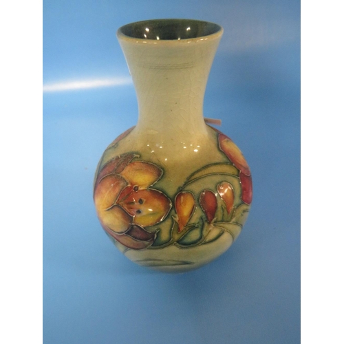 282 - A SMALL MOORCROFT VASE WITH FLORAL DECORATION