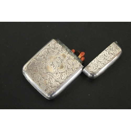 325 - A HALLMARKED SILVER VESTA