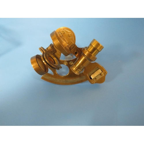 446 - A SMALL BRASS SEXTANT