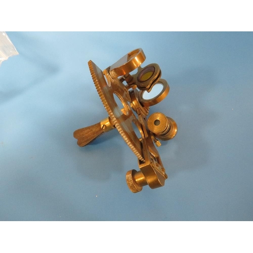 446 - A SMALL BRASS SEXTANT