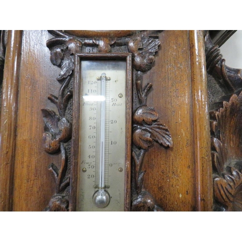 466 - AN ANTIQUE HEAVILY CARVED WALL BAROMETER A/F