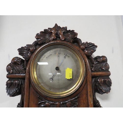 466 - AN ANTIQUE HEAVILY CARVED WALL BAROMETER A/F