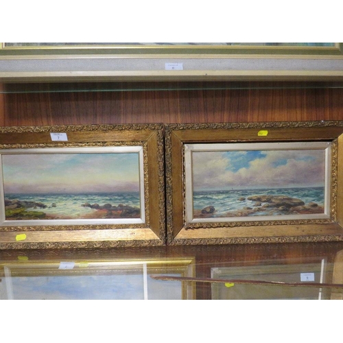 7 - A PAIR OF GILT FRAMED ROCKY SEASCAPES, BOTH SIGNED LOWER RIGHT BY T.P. FALLAW, 16.5 X 34.5 CM A/F