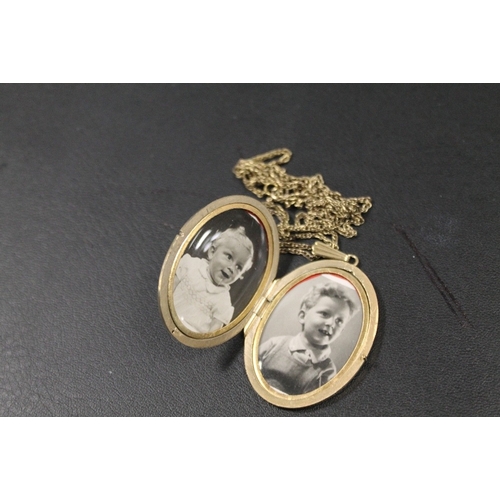 352 - A  LOCKET AND CHAIN - LOCKET MARKED ROLLED GOLD