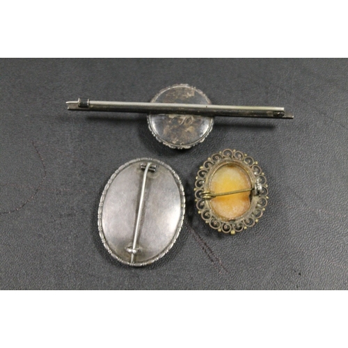 355 - TWO LARGE SILVER BROOCHES AND A SHELL CAMEO BROOCH