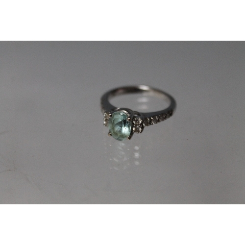 156 - AN 18CT WHITE GOLD 'ILIANA' APATITE RING, with diamond set shoulders