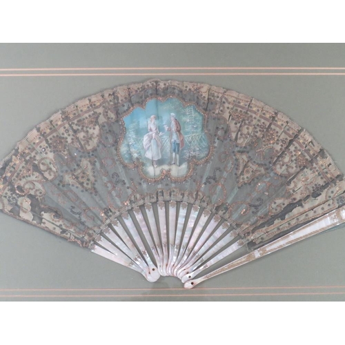 120 - A LATE 18TH / EARLY 19TH CENTURY PAINTED AND DECORATIVE FAN, the central study depicting a couple in... 