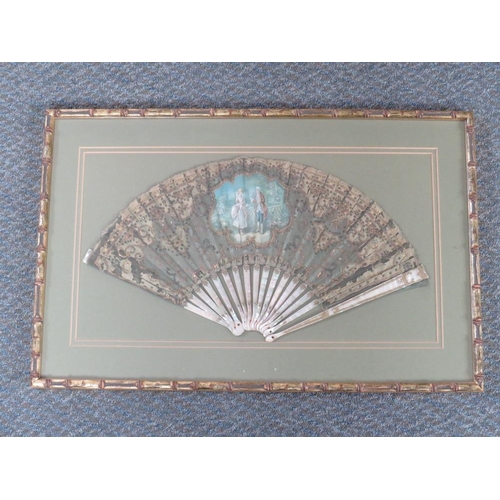 120 - A LATE 18TH / EARLY 19TH CENTURY PAINTED AND DECORATIVE FAN, the central study depicting a couple in... 