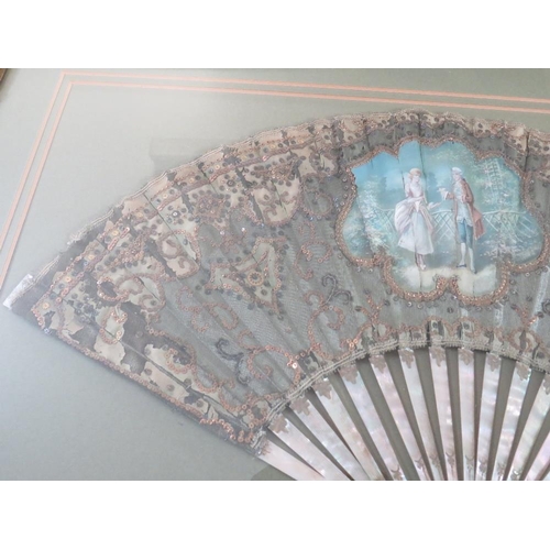 120 - A LATE 18TH / EARLY 19TH CENTURY PAINTED AND DECORATIVE FAN, the central study depicting a couple in... 