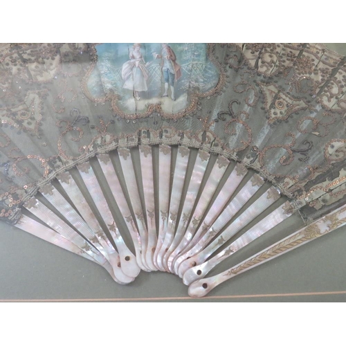 120 - A LATE 18TH / EARLY 19TH CENTURY PAINTED AND DECORATIVE FAN, the central study depicting a couple in... 