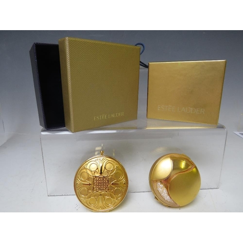 127 - TWO VINTAGE ESTEE LAUDER POWDER COMPACTS, both boxed and with protective cloth 'bags', approx Dia. 6... 