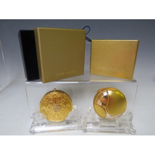 127 - TWO VINTAGE ESTEE LAUDER POWDER COMPACTS, both boxed and with protective cloth 'bags', approx Dia. 6... 