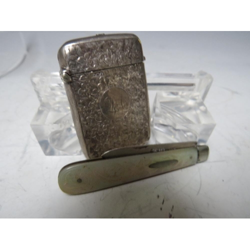 138 - A HALLMARKED SILVER VESTA CASE, together with a silver bladed and mother of pearl fruit knife (2)