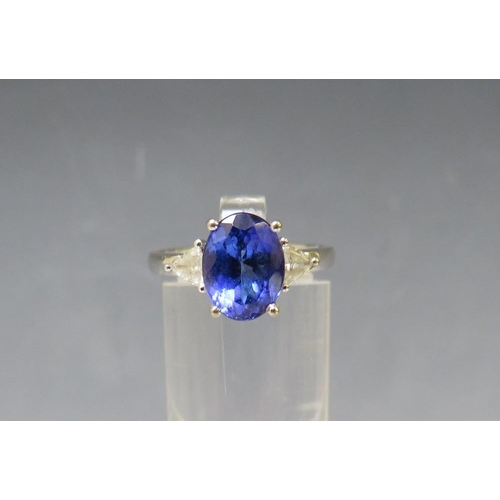 155 - AN 18CT WHITE GOLD 'ILIANA' SAPPHIRE RING, with diamond set shoulders, ring size O ½