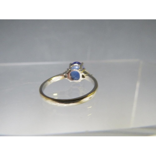 155 - AN 18CT WHITE GOLD 'ILIANA' SAPPHIRE RING, with diamond set shoulders, ring size O ½