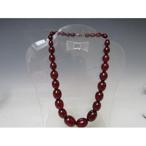 163 - A VINTAGE SINGLE STRAND CHERRY AMBER GRADUATED BEAD NECKLACE, largest bead Dia. approx. 2.2 cm, appr... 