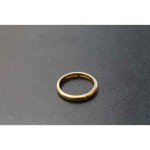 167 - A SMALL HALLMARKED 22 CARAT GOLD WEDDING BAND, approx weight 2.7g