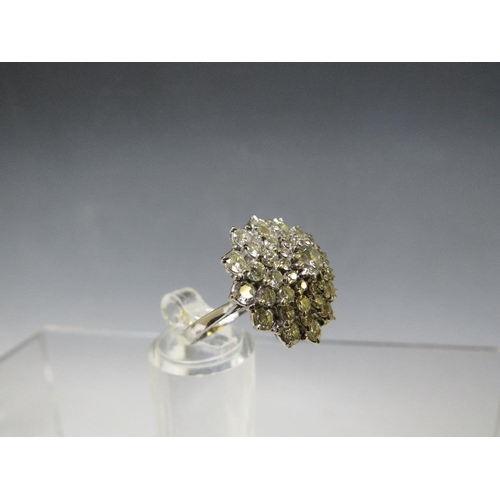 171 - A HALLMARKED 18 CARAT WHITE GOLD DIAMOND CLUSTER RING, set with five rows of brilliant cut diamonds ... 