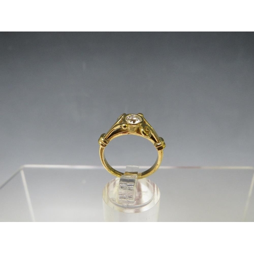 174 - A HALLMARKED 18 CARAT GOLD HALF CARAT DIAMOND RING, in an unusual split swirl band setting, the insu... 