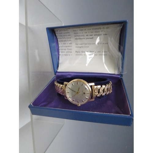 203 - A TISSOT 9CT GOLD CASED WRISTWATCH, on expanding yellow metal strap, together with original box and ... 