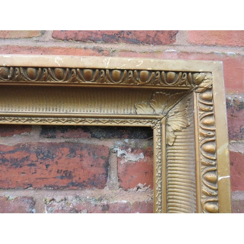 21 - A GILT RECTANGULAR PICTURE FRAME, with egg and dart moulded detail, rebate 82 x 57 cm