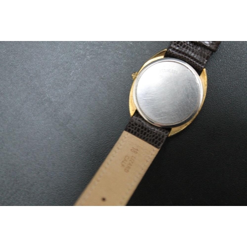 214 - LONGINES - A 1980'S GOLD PLATED QUARTZ DATE WRIST WATCH, on replacement leather strap, Dia 3.5 cmCon... 