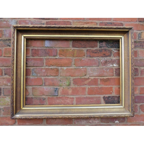 22 - A GILT RECTANGULAR PICTURE FRAME, with acanthus moulded detail, rebate 83 x 57 cm