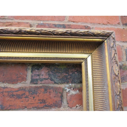 22 - A GILT RECTANGULAR PICTURE FRAME, with acanthus moulded detail, rebate 83 x 57 cm