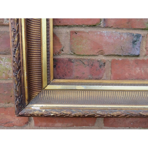 22 - A GILT RECTANGULAR PICTURE FRAME, with acanthus moulded detail, rebate 83 x 57 cm