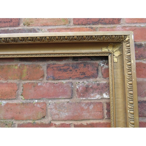 23 - A GILT RECTANGULAR PICTURE FRAME, with egg and dart moulded detail, rebate 82 x 57 cm