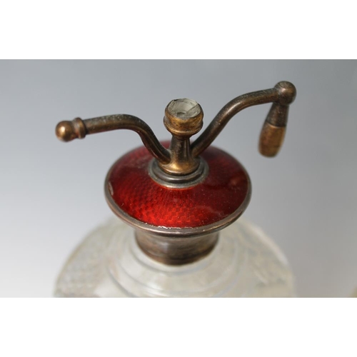 233 - A SILVER AND GUILLOCHE ENAMEL TOPPED CUT GLASS ATOMIZER, in rich ruby red enamel, stamped 'Sterling'... 