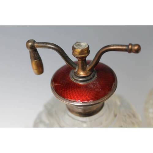 233 - A SILVER AND GUILLOCHE ENAMEL TOPPED CUT GLASS ATOMIZER, in rich ruby red enamel, stamped 'Sterling'... 