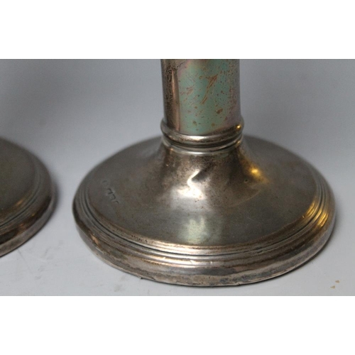 237 - A PAIR OF HALLMARKED SILVER CANDLESTICKS - BIRMINGHAM 1922, one with damage to base, bases filled, H... 