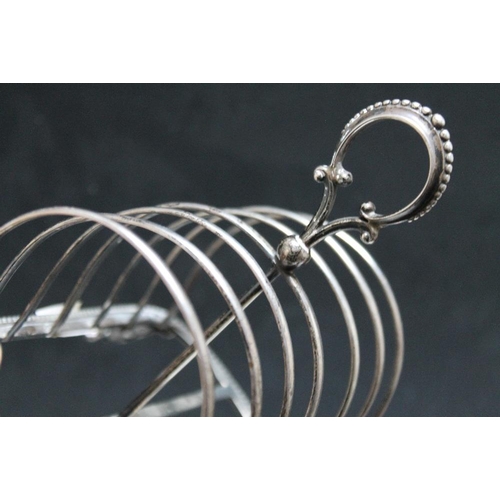 242 - A HALLMARKED SILVER SIX DIVISION TOAST RACK - LONDON 1864, makers mark indistinct but probably that ... 