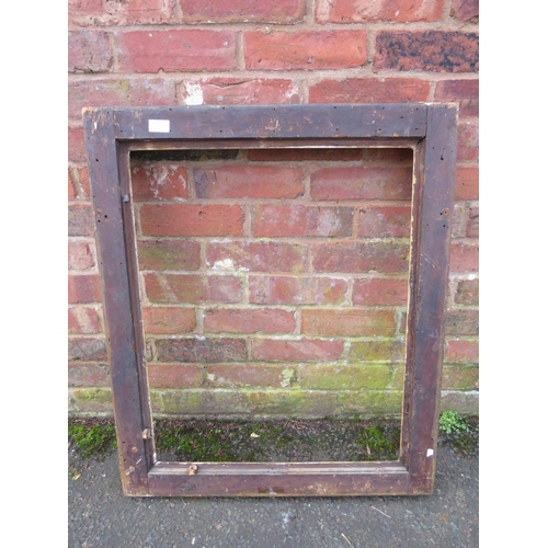 25 - A GILT RECTANGULAR PICTURE FRAME, with foliate moulded detail to each corner, rebate 68 x 55 cm