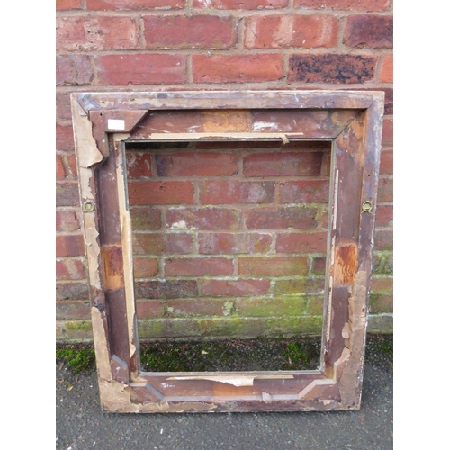 26 - A GILT RECTANGULAR PICTURE FRAME, with raised moulded foliate detail, rebate 65 x 52 cm