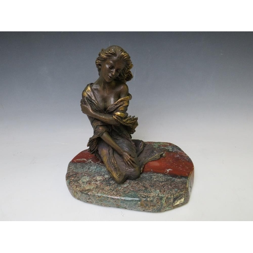 268 - AN EBANO BRONZED SCULPTURE FROM THE VIDAL COLLECTION DEPICTING A KNEELING SEMI NUDE GIRL, raised on ... 