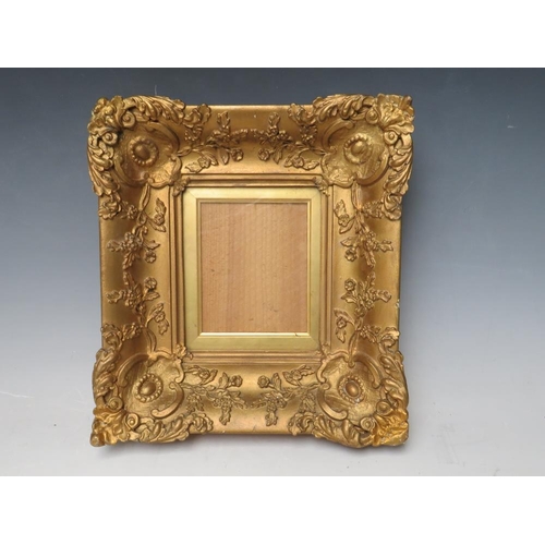 28 - A 19TH CENTURY SMALL DECORATIVE GOLD FRAME, with gold slip and glazed, frame W 7 cm, slip rebate 13.... 