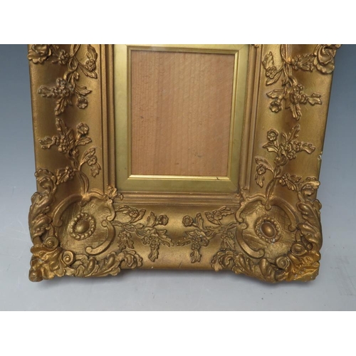 28 - A 19TH CENTURY SMALL DECORATIVE GOLD FRAME, with gold slip and glazed, frame W 7 cm, slip rebate 13.... 