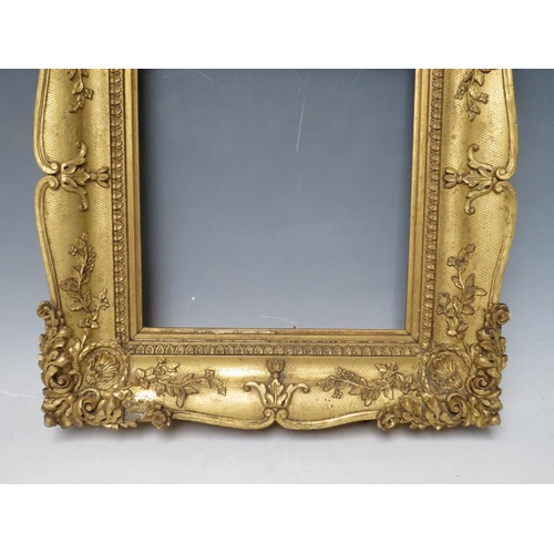 29 - A 19TH CENTURY DECORATIVE GOLD SWEPT FRAME, frame W 6.5 cm, rebate 23 x 20 cm