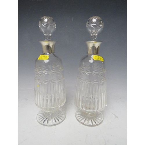 331 - A PAIR OF SILVER COLLARED GLASS DECANTERS - BIRMINGHAM 1929, H 25 cm