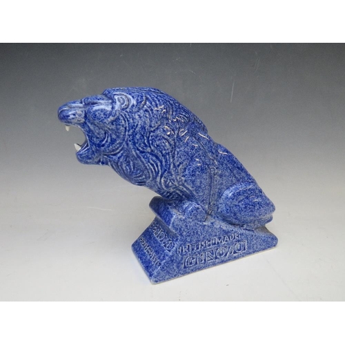 336 - AN ASHSTEAD POTTERS (1923-35) LION ADVERTISING FIGURE, for Genozo toothpaste, in a blue glaze, H 19 ... 