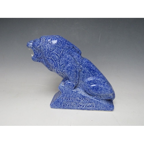 336 - AN ASHSTEAD POTTERS (1923-35) LION ADVERTISING FIGURE, for Genozo toothpaste, in a blue glaze, H 19 ... 