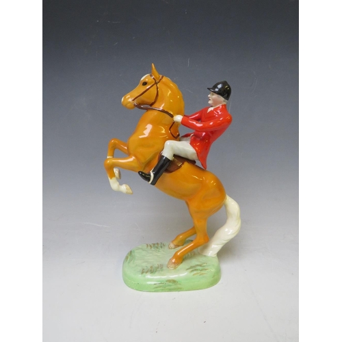 344 - A BESWICK RARE HUNTSMAN ON REARING PALOMINO - No. 868, H 24 cm