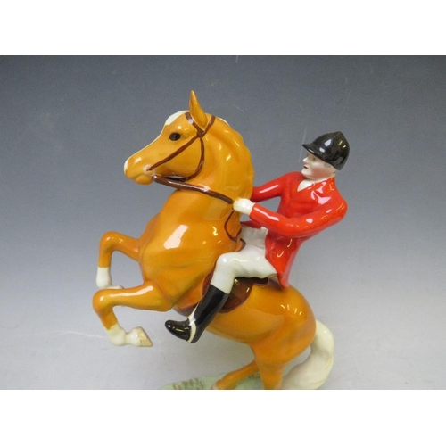 344 - A BESWICK RARE HUNTSMAN ON REARING PALOMINO - No. 868, H 24 cm