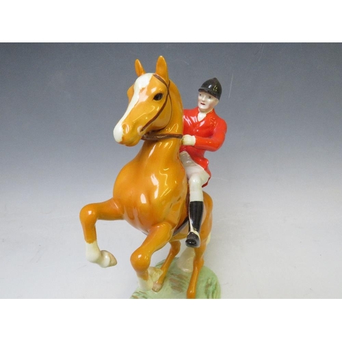 344 - A BESWICK RARE HUNTSMAN ON REARING PALOMINO - No. 868, H 24 cm