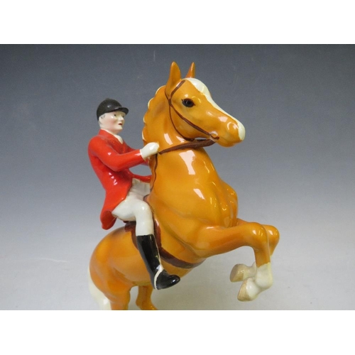 344 - A BESWICK RARE HUNTSMAN ON REARING PALOMINO - No. 868, H 24 cm