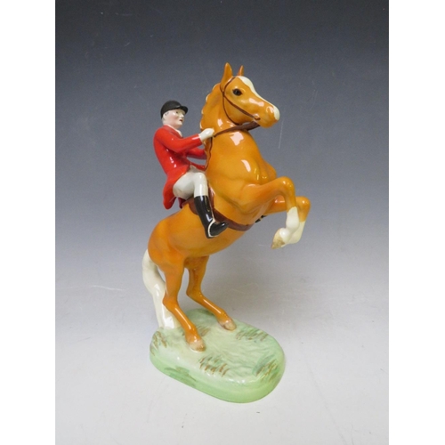 344 - A BESWICK RARE HUNTSMAN ON REARING PALOMINO - No. 868, H 24 cm