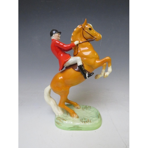 344 - A BESWICK RARE HUNTSMAN ON REARING PALOMINO - No. 868, H 24 cm