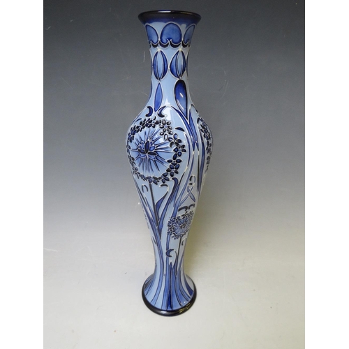 346 - A MOORCROFT POTTERY FLORIAN SLENDER VASE, with tubelined floral sprays on contrasting blue ground, m... 